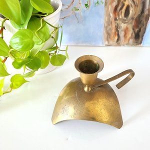 Vintage brass candleholder on stand with handle.